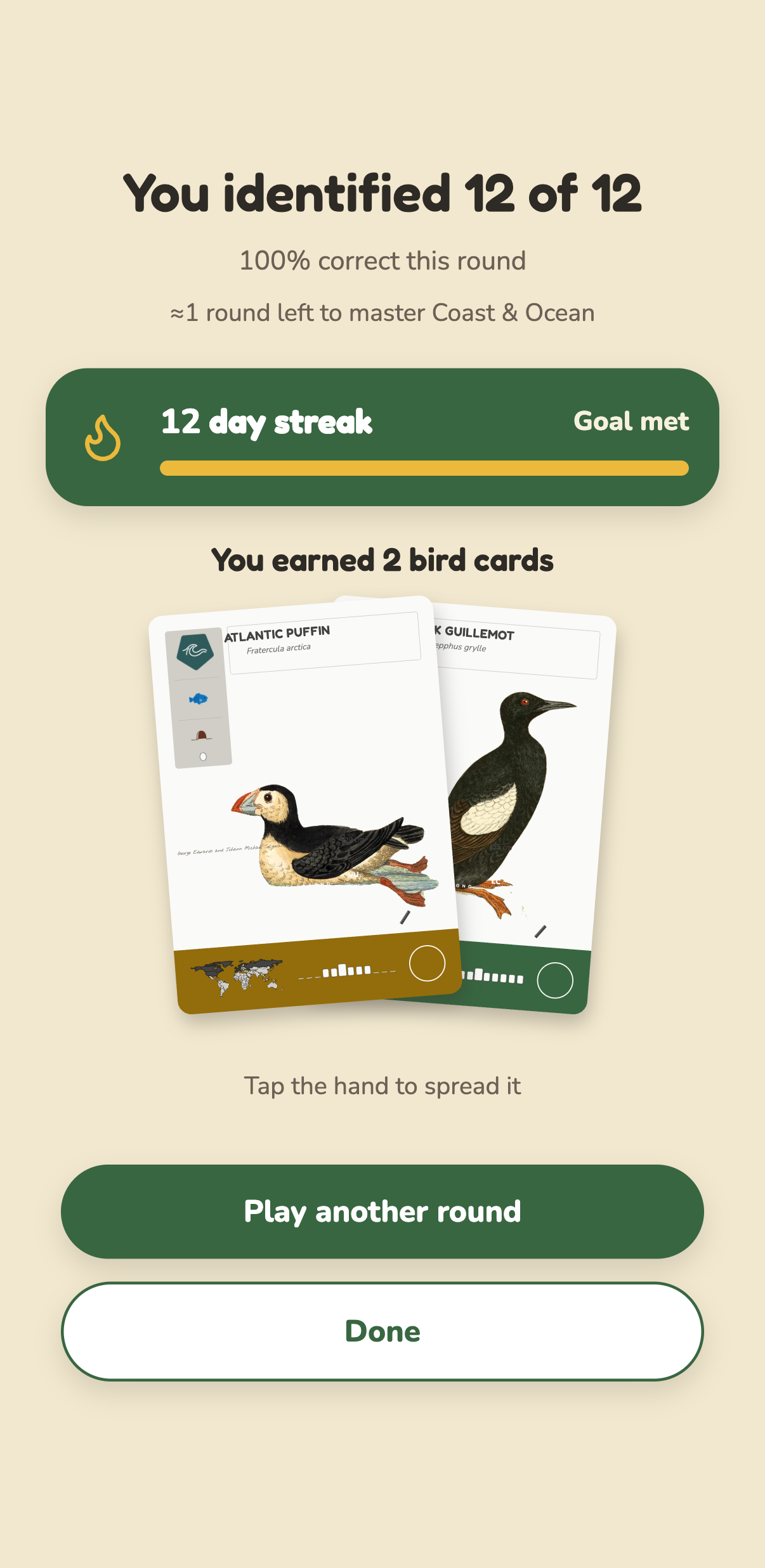 The end of a round: 12 of 12 identified, a 12 day streak with the day's goal met, and two new bird cards won, the Atlantic Puffin and the Black Guillemot, dealt as a hand